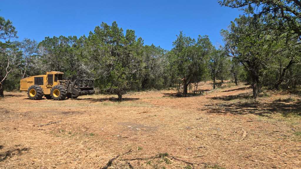 Cleared and widened ranch trail with oaks preserved on 5 acres in Llano Texas