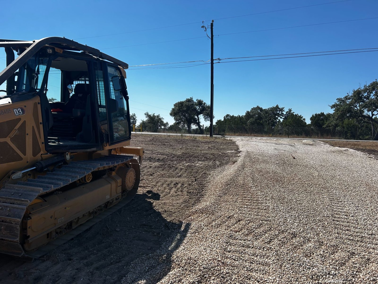 Dozer grading a freshly cleared pad on an Austin area project