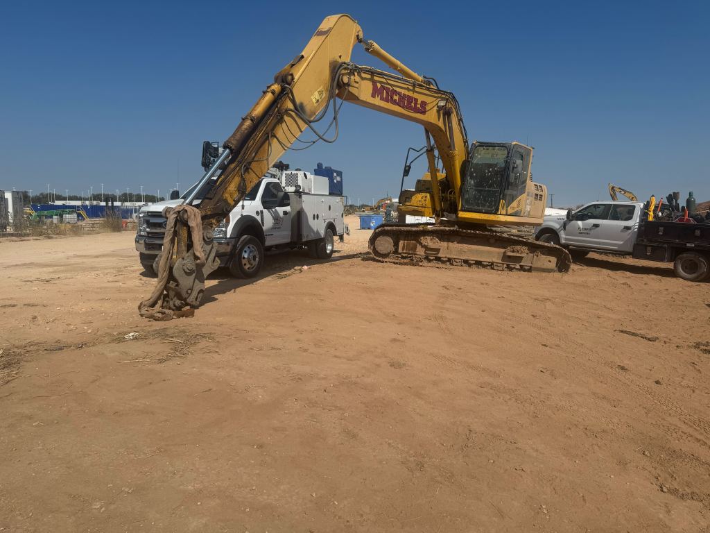 Excavator working near the Tesla factory corridor in Del Valle TX