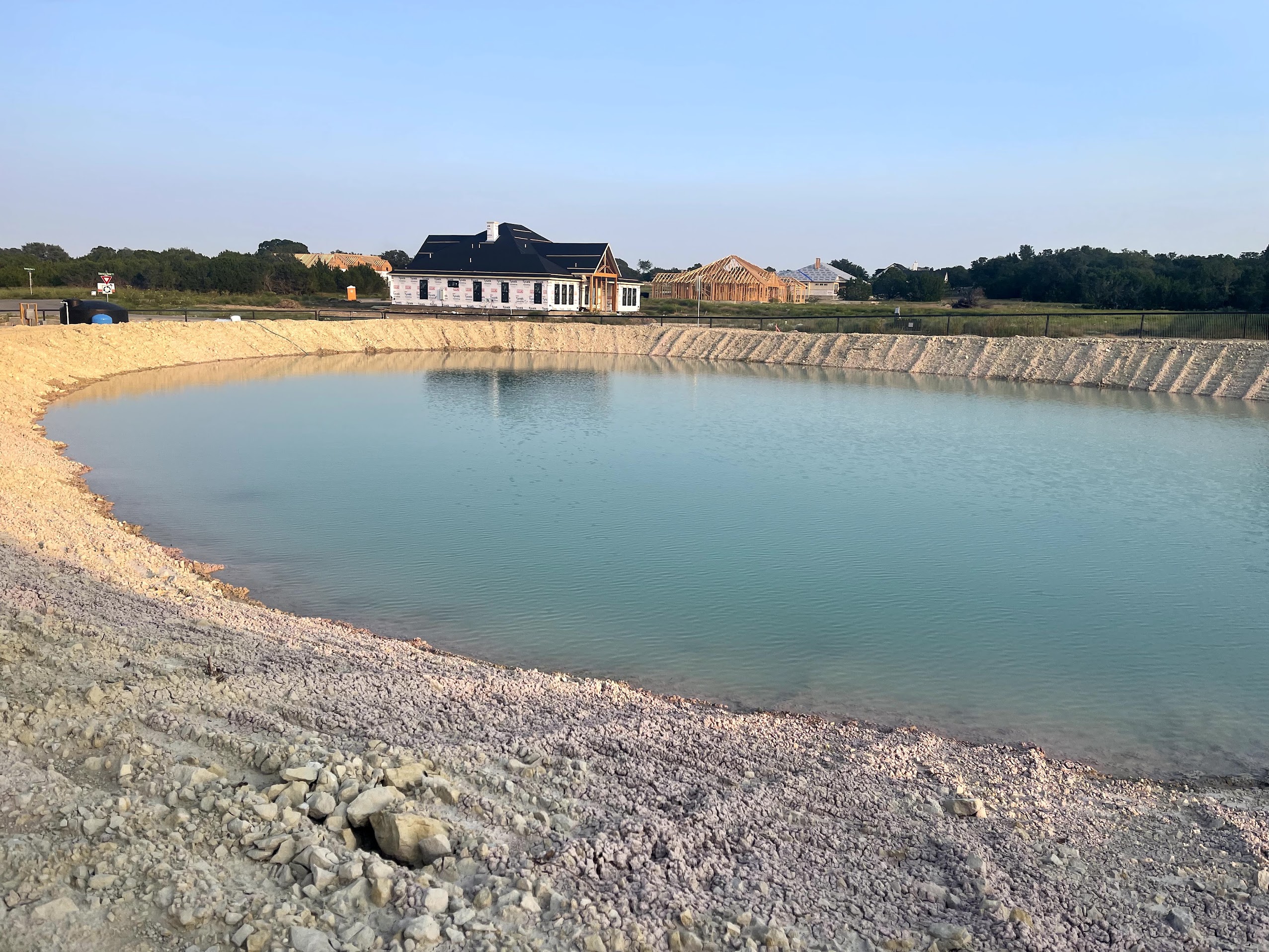 Finished pond full of water in Liberty Hill Texas