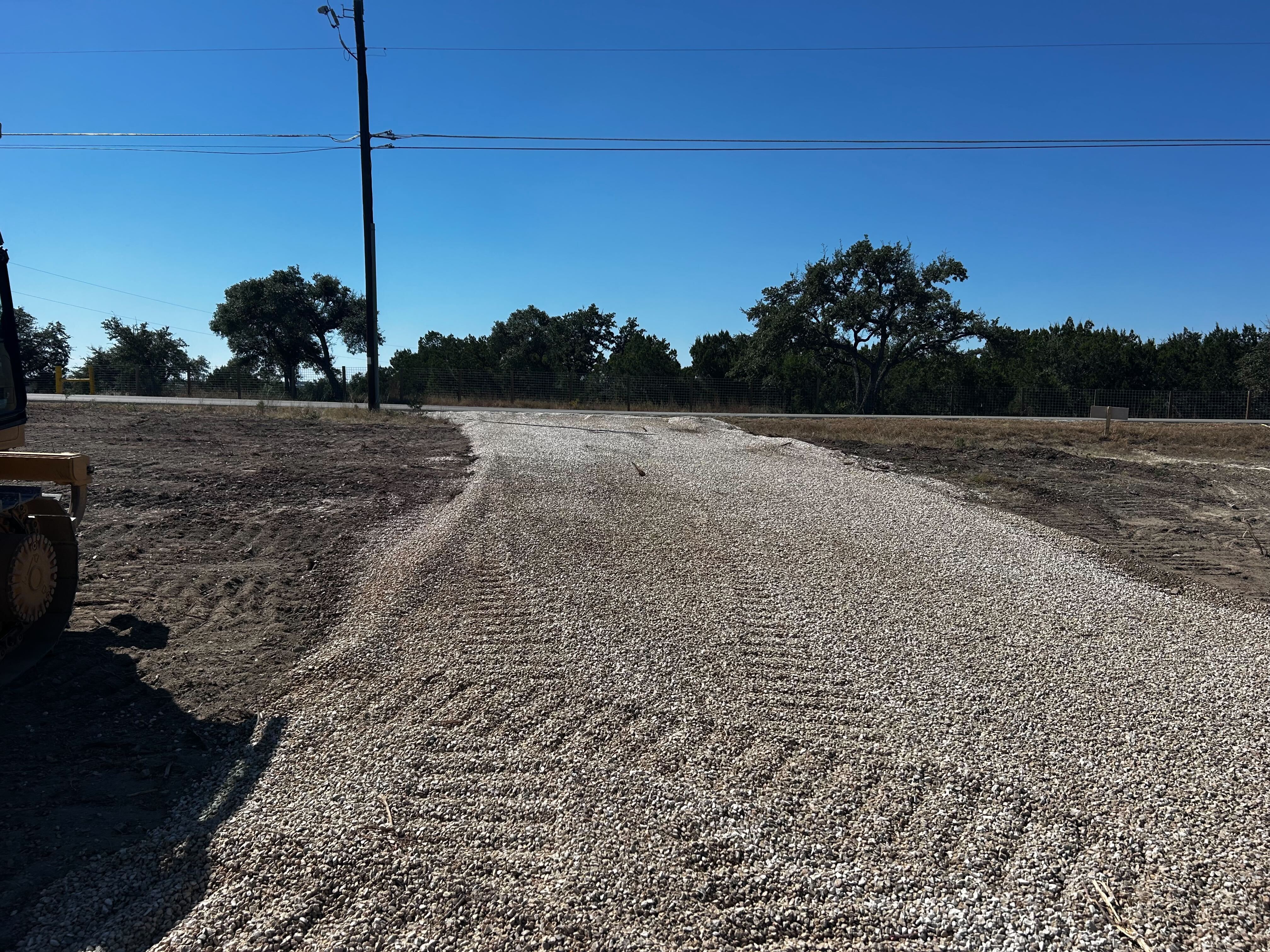 Cleared and graded site with placed stone in southeast Austin near Del Valle