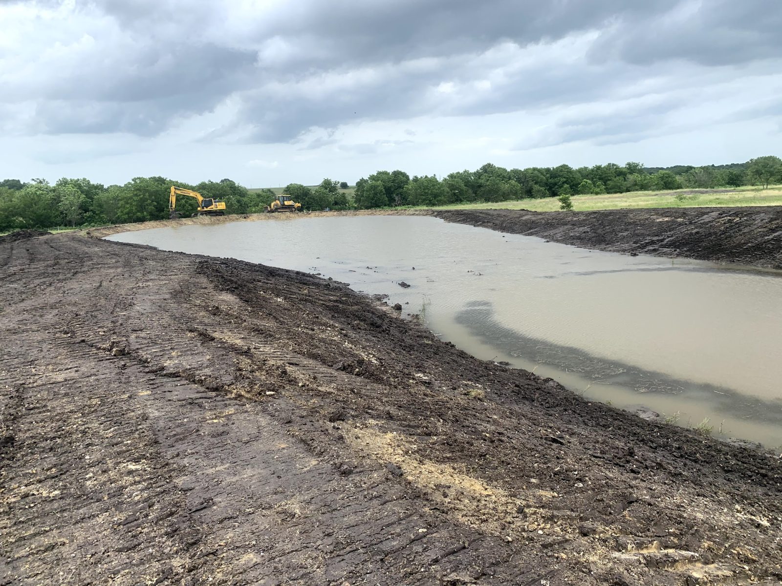 Aerial view of lined pond build in Manor Texas