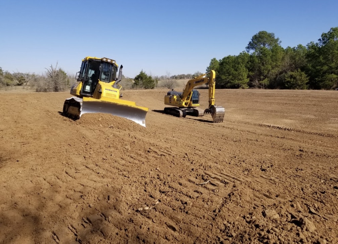 Pond construction in sandy Lost Pines ground near Paige Texas