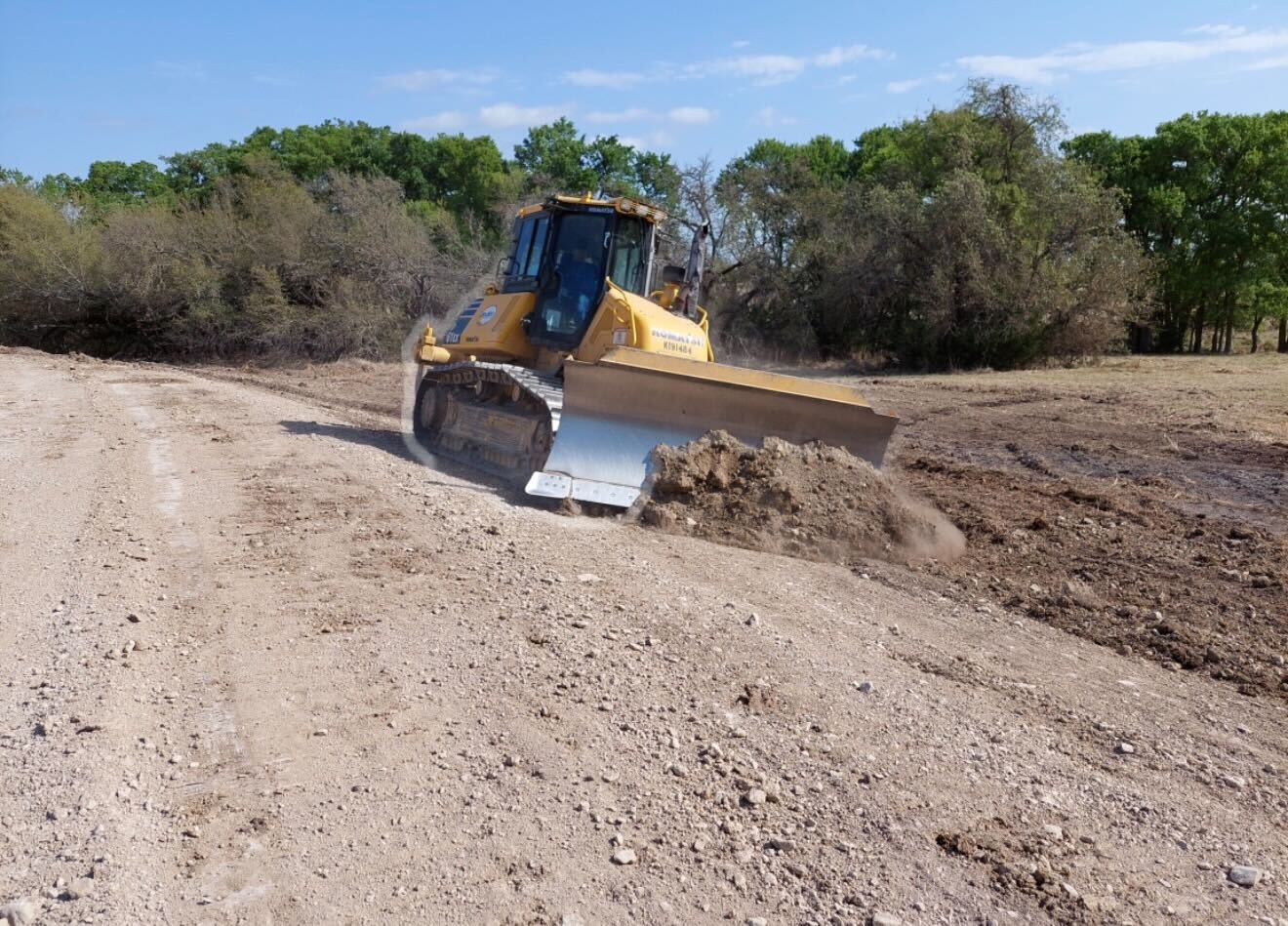 Dozer grading a pond dam near Lampasas Texas