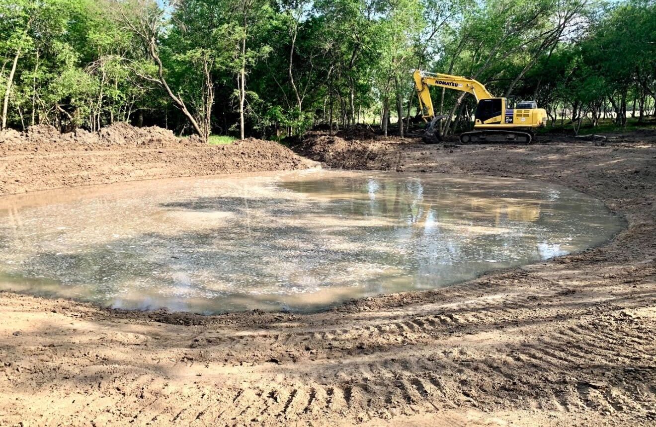 Finishing a quarter acre pond near Bastrop Texas